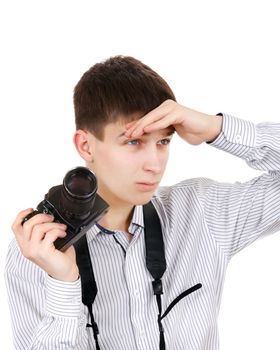 Serious Teenager with a Vintage Photo Camera Isolated on the White