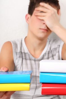 Sad Student with the Books Isolated on the White Background