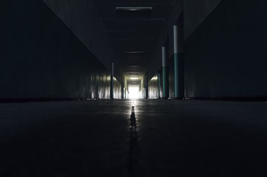 dark corridor with light in horizon