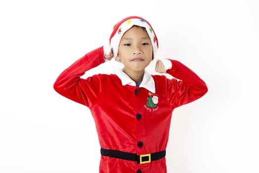 Asian little boy in red santa hat on white background