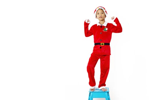 Asian little boy in red santa hat on white background