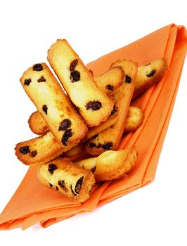 Heap of Biscuit Raisin Cookies on Orange Napkin isolated on White background