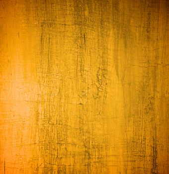 Golden Damaged Obsolete Cement Wall Background closeup