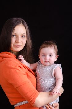 Portrait of mother and baby at the hands of six mothers