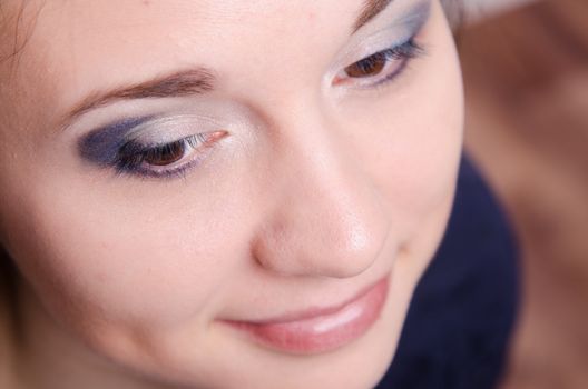 Portrait of beautiful girl with bright makeup, makeup process