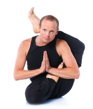 Young and handsome man doing yoga. Isolated on white backgraund