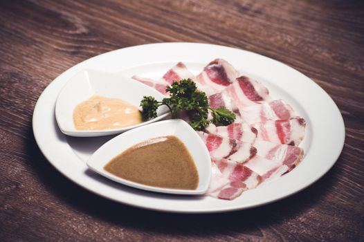 slised salo porc fat bacon with horseredish 