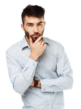 A young bearded man with a serious expression on his face isolated on white background