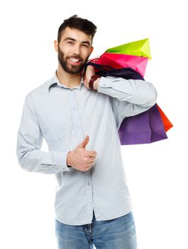 Handsome man holding shopping bags. Christmas and holidays concept