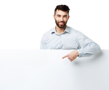 A young bearded man showing blank signboard, isolated over white background