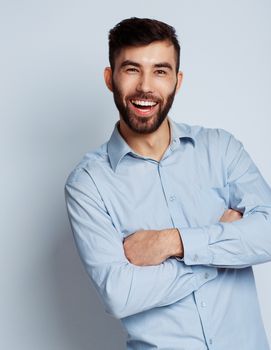 A young bearded man smiling