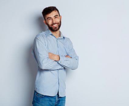 A young bearded man smiling