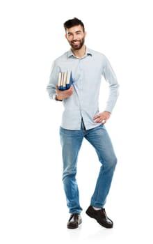 Young bearded smiling man with books in hands on white background