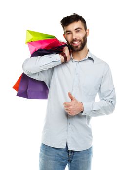 Handsome man holding shopping bags. Christmas and holidays concept