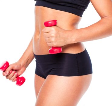 Beautiful slim woman with dumbbells, isolated on white background