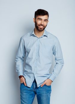 A young bearded man smiling