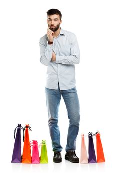 Handsome man with shopping bags. Christmas and holidays concept