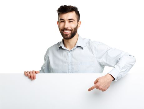 A young bearded man showing blank signboard, isolated over white background