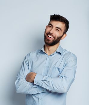 A young bearded man smiling