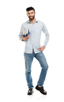 Young bearded smiling man with books in hand on white background