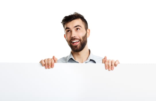 A young bearded man showing blank signboard, isolated over white background