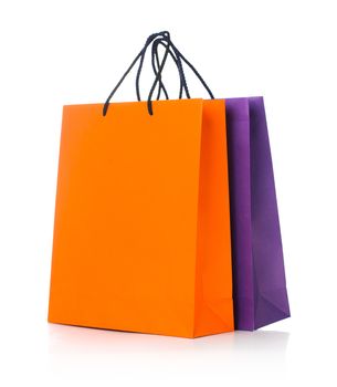Two paper Shopping bags with reflection on white background