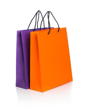 Two paper Shopping bags with reflection on white background