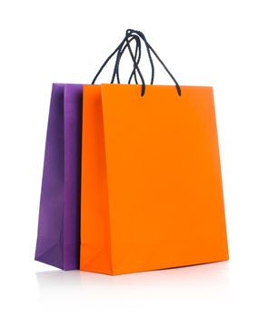 Two paper Shopping bags with reflection on white background