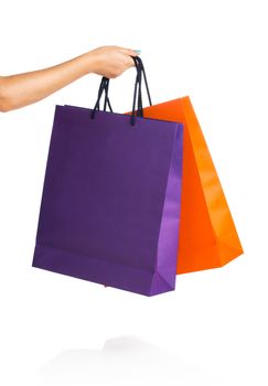 Two paper Shopping bags in woman hand