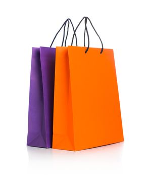 Two paper Shopping bags with reflection on white background