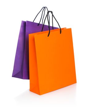 Two paper Shopping bags with reflection on white background