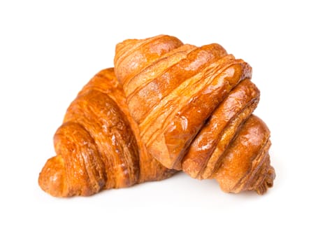 Fresh and tasty croissant over white background