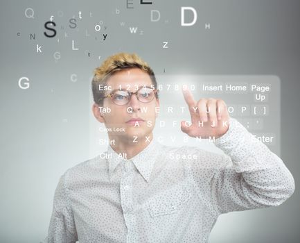 Young businessman pressing application button on computer with touch screen