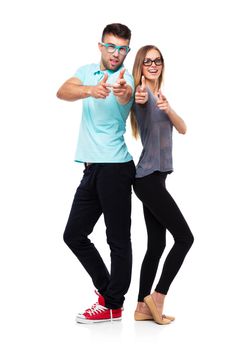 Happy couple smiling holding thumb up gesture, beautiful young man and woman smile looking at camera on white background