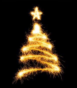 Christmas tree made by sparkler on a black background