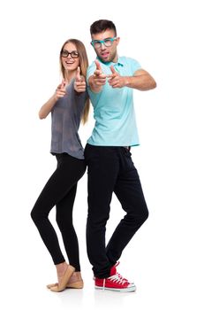 Happy couple smiling holding thumb up gesture, beautiful young man and woman smile looking at camera on white