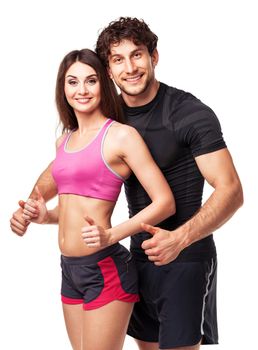 Athletic man and woman after fitness exercise with a finger up on the white background