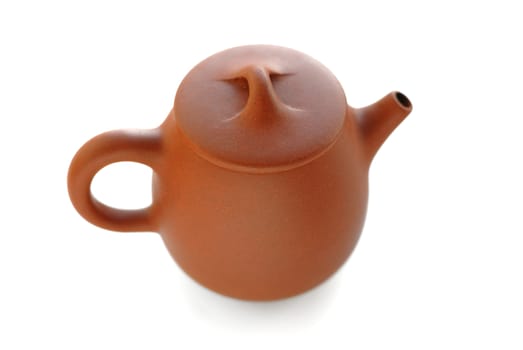 Yixing red clay teapot top view isolated