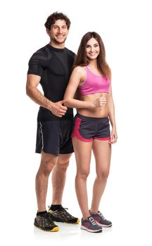 Athletic couple - man and woman with thumb up on the white background
