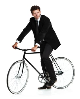 Attractive man in a classic suit with a bicycle on a white background