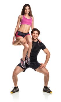 Sports guy holds on shoulder a girl on a white background