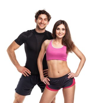 Athletic man and woman after fitness exercise on the white background
