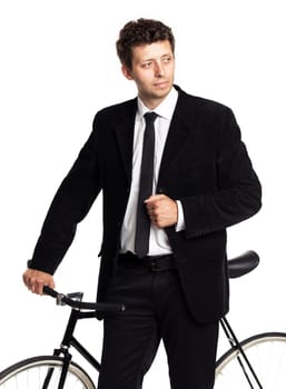 Attractive man in a classic suit with a bicycle on a white background