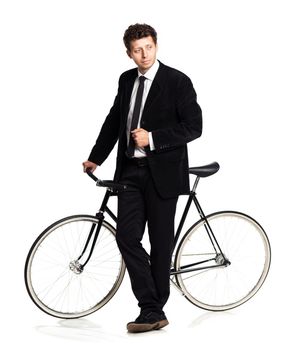 Attractive man in a classic suit with a bicycle on a white background