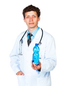 Portrait of a smiling male doctor holding bottle of water on white background