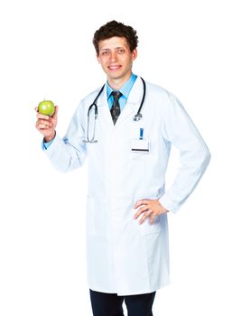 Portrait of a smiling male doctor holding green apple on white background