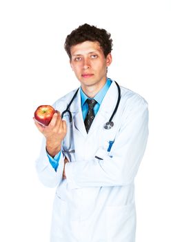 Portrait of a male doctor holding red apple on white background