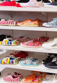 Background with shoes on shelves of shop