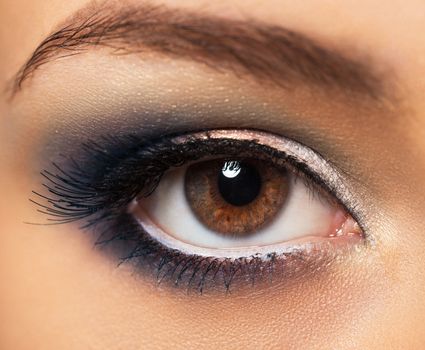 Closeup of beautiful womanish eye with glamorous makeup