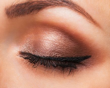 Closeup of beautiful womanish eye with neutral makeup